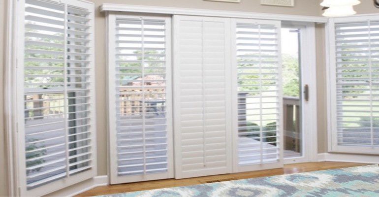 [Polywood|Plantation|Interior ]211] shutters on a sliding glass door in Destin